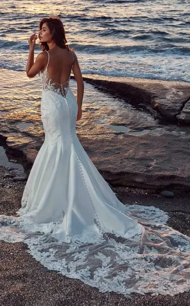 full back of eddy k dr2606 ivory mikado fit and flare wedding dress with lace accents throughout, and a long lace train