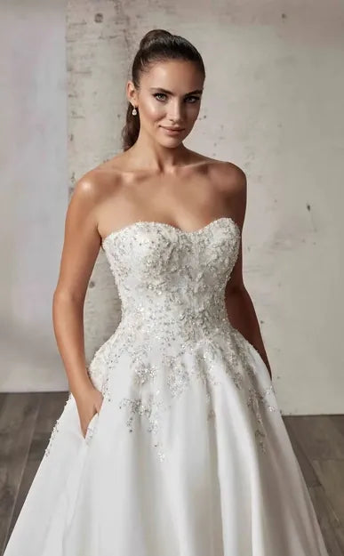 close up of eddy k loretta organza ball gown with a strapless beaded bodice with a sweetheart neckline