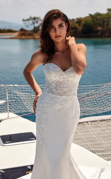 close up of eddy k medina ivory mikado fit and flare wedding dress showing the sweetheart bodice and floral lace