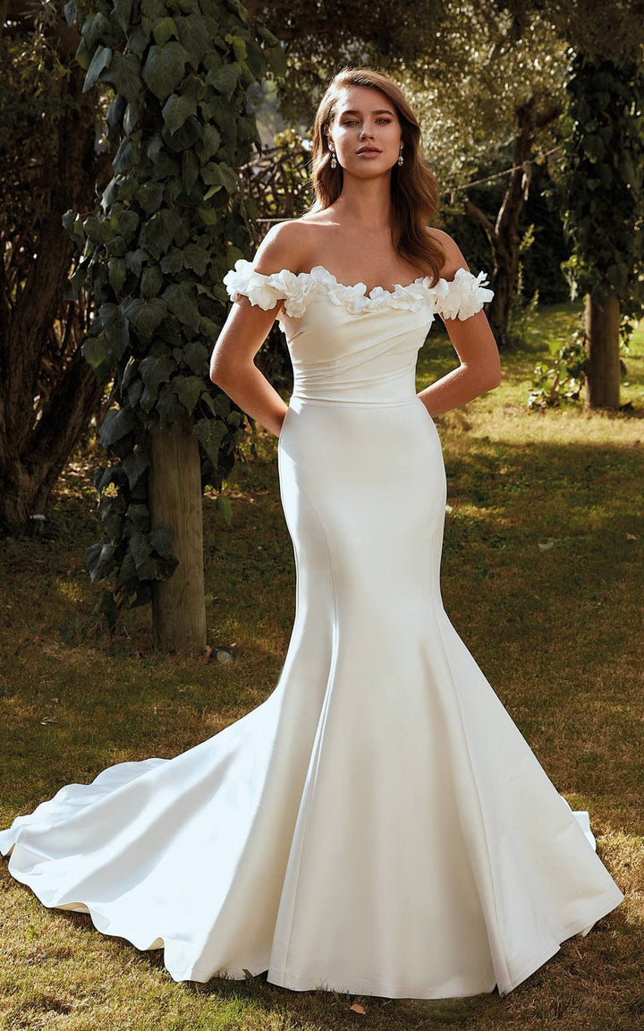 full front of eddy k tilly ivory mikado fit and flare wedding dress with an off the shoulder neckline accents with florals