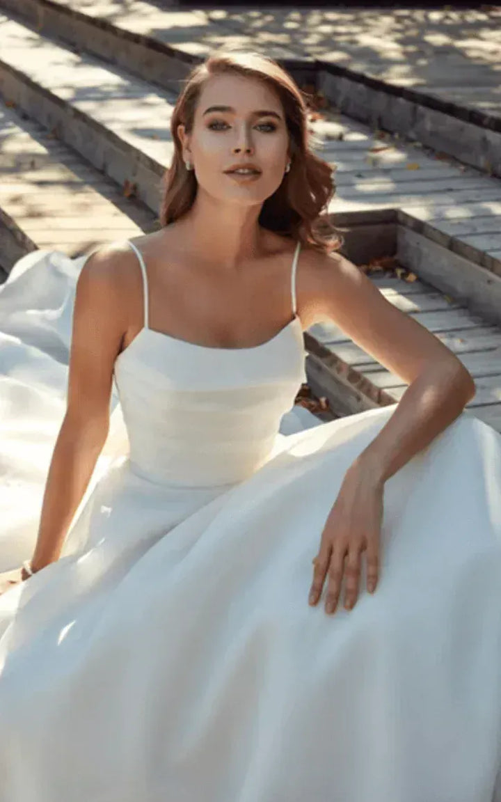close up of eddy k chrissy nude organza a-line wedding dress showing the scoop neck bodice