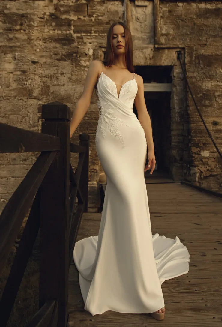full front of elissar bridal chantelle ivory crepe fitted wedding dress with lace applques on the bodice and a v neckline