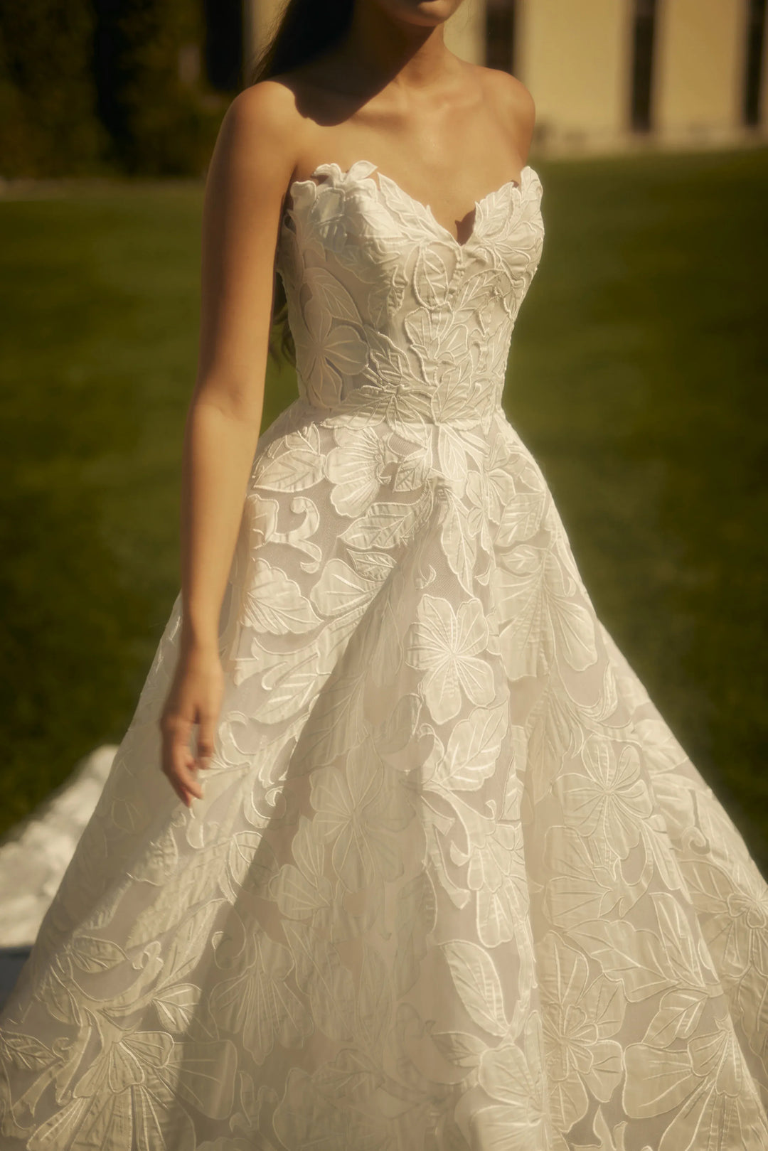 White lace wedding dress with a blurred background