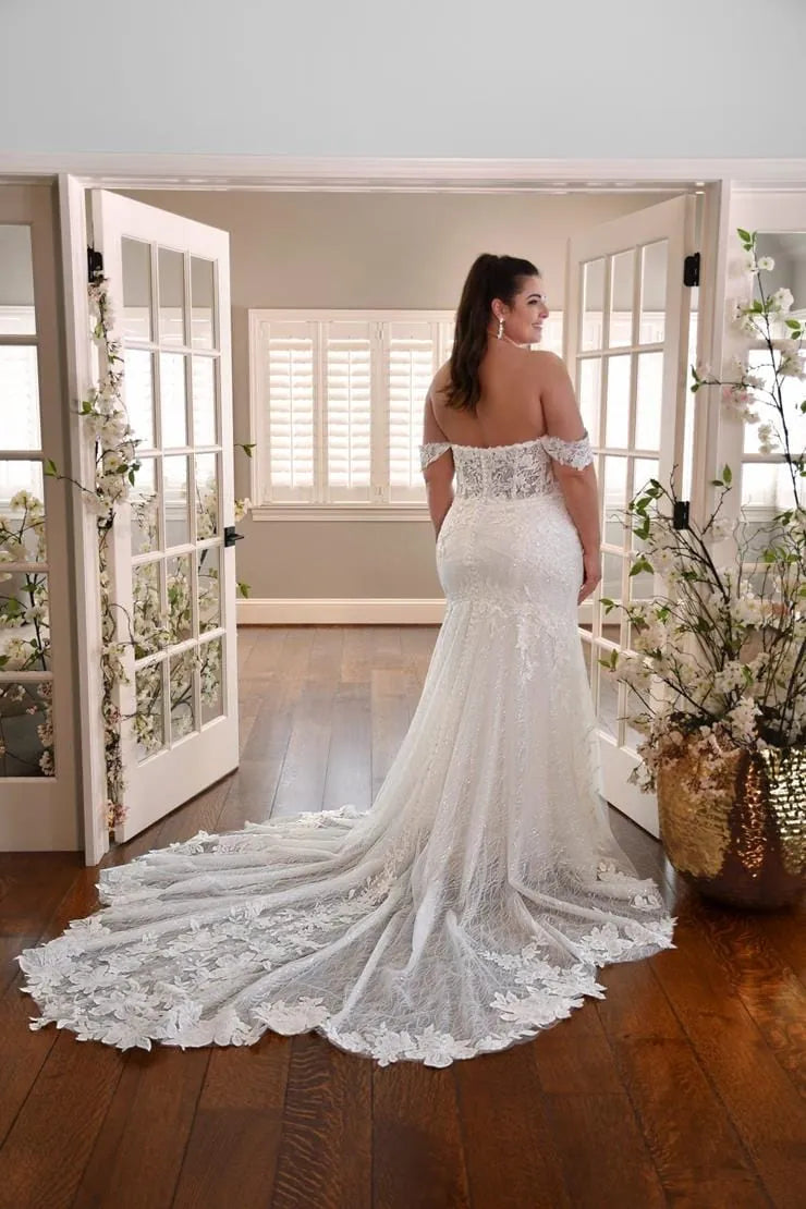 full back of essense of australia d3253 lace fitted wedding dress featuring a long shaped lace train