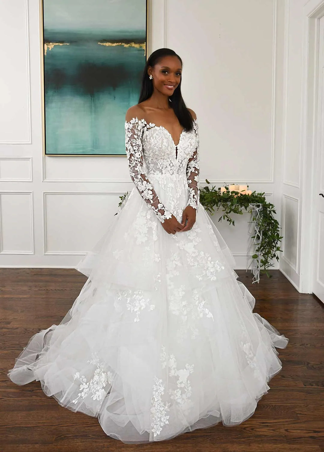 front of essense of australia d3274 tulle ball gown wedding dress with scattered lace appliques and an off the shoulder long sleeve neckline