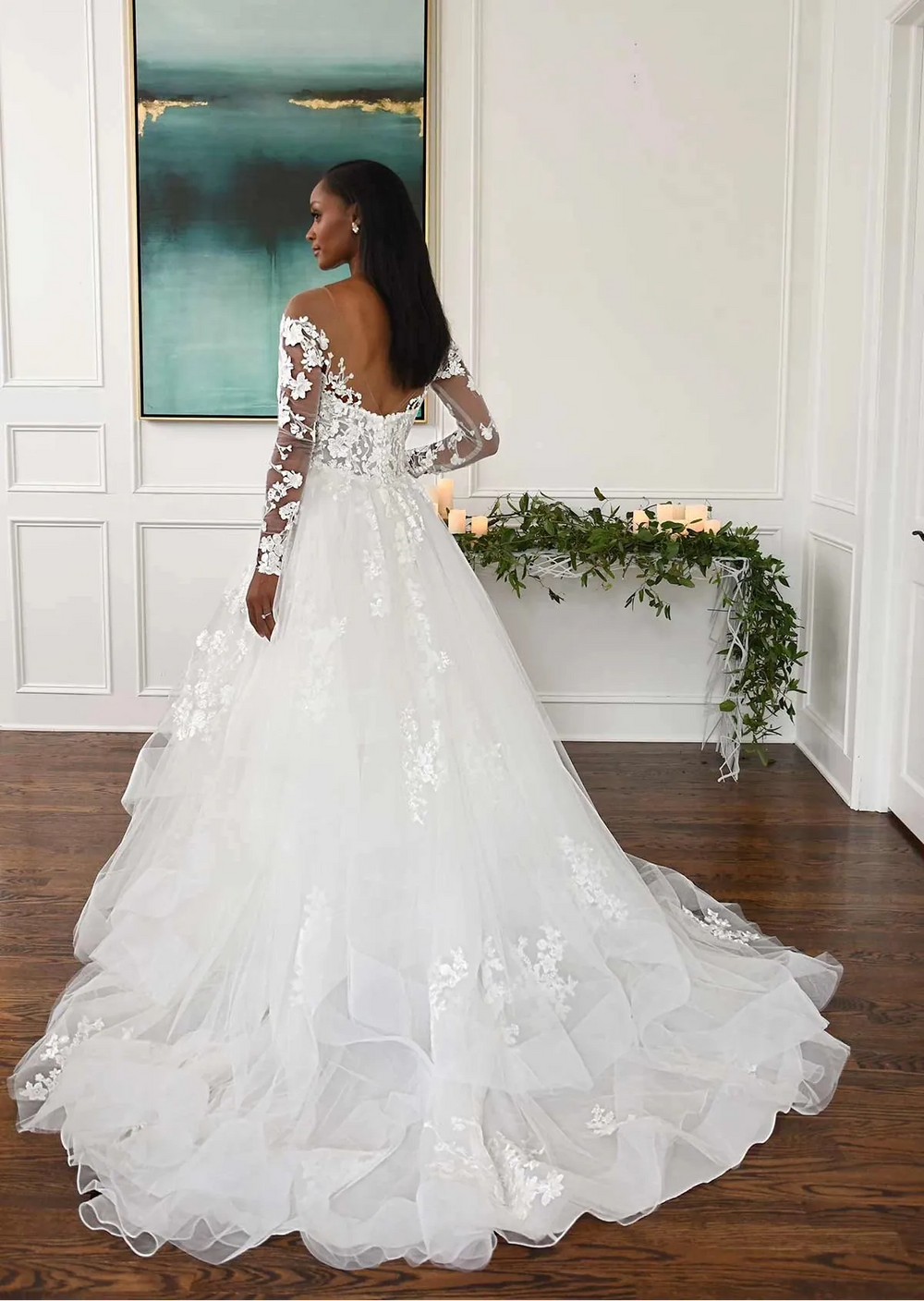 back of essense of australia d3274 tulle ball gown wedding dress with open back, sheer long sleeves, and layered skirt trimmed with horsehair
