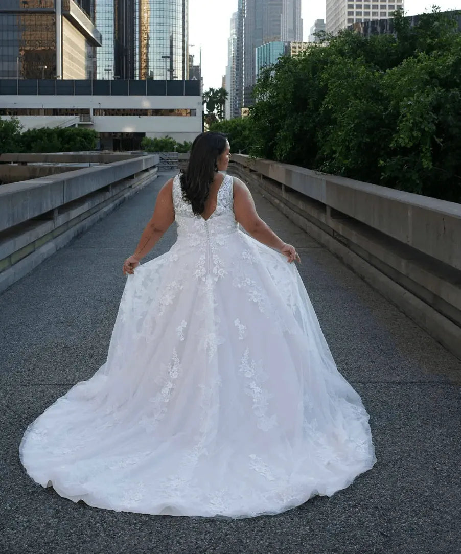 full back of essense of australia d3654 champagne tulle a-line wedding dress featuring an open back, scattered lace appliques, and a chapel length train