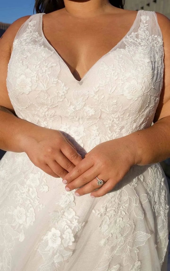 close up of essense of australia d3654 champagne tulle a-line wedding dress showing the v neck bodice with thick straps