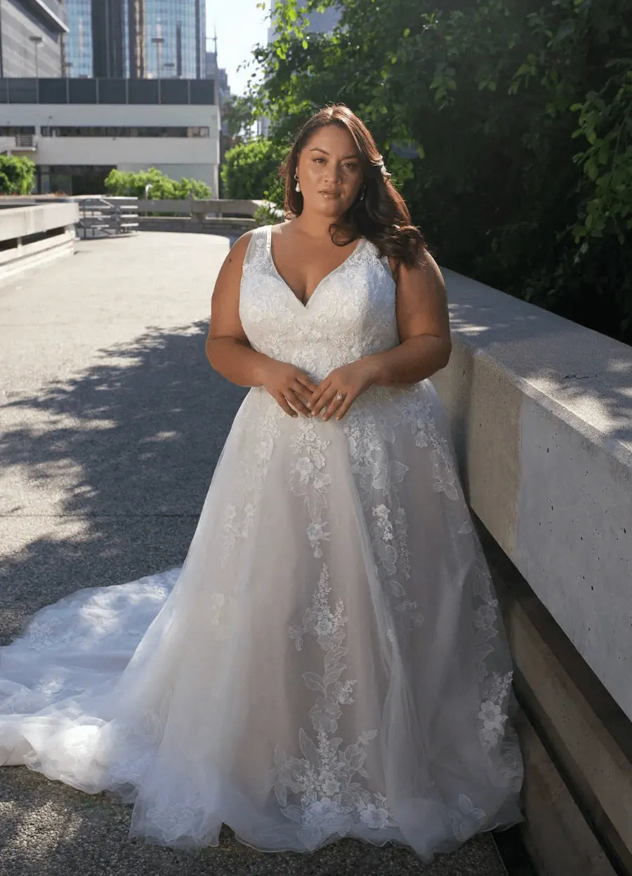 full front of essense of australia d3654 champagne tulle a-line wedding dress featuring a v neckline, thick straps, and scattered lace appliques