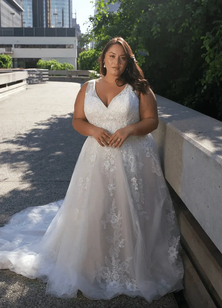 full front of essense of australia d3654 champagne tulle a-line wedding dress featuring a v neckline, thick straps, and scattered lace appliques