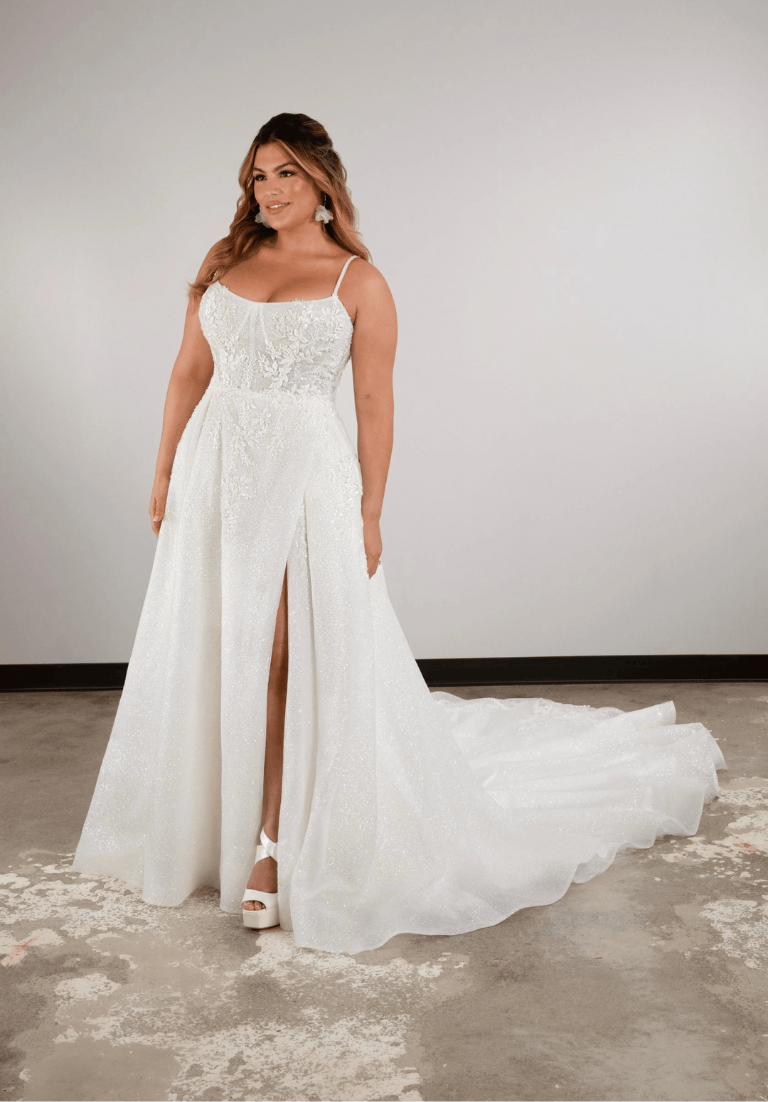 full front of essense of australia d3812 ivory tulle a-line wedding dress featuring  a scoop neckline, thin straps, and a slit in the skirt