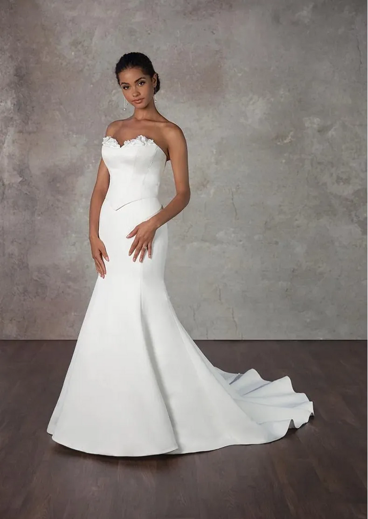 front of essense d4115 satin ivory fit and flare wedding dress with a basque waist and floral accents on the neckline