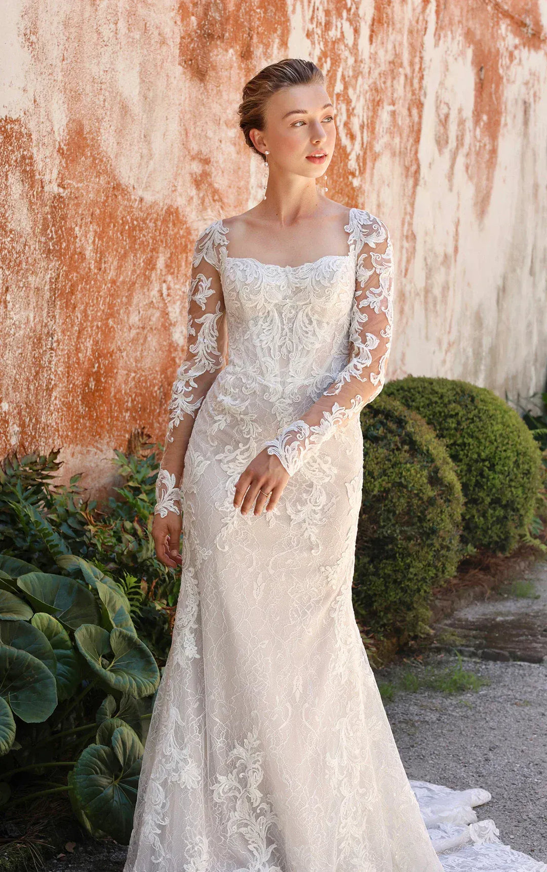 full front of essense d4172 ivory lace sheath wedding dress with long sleeves and a shaped train