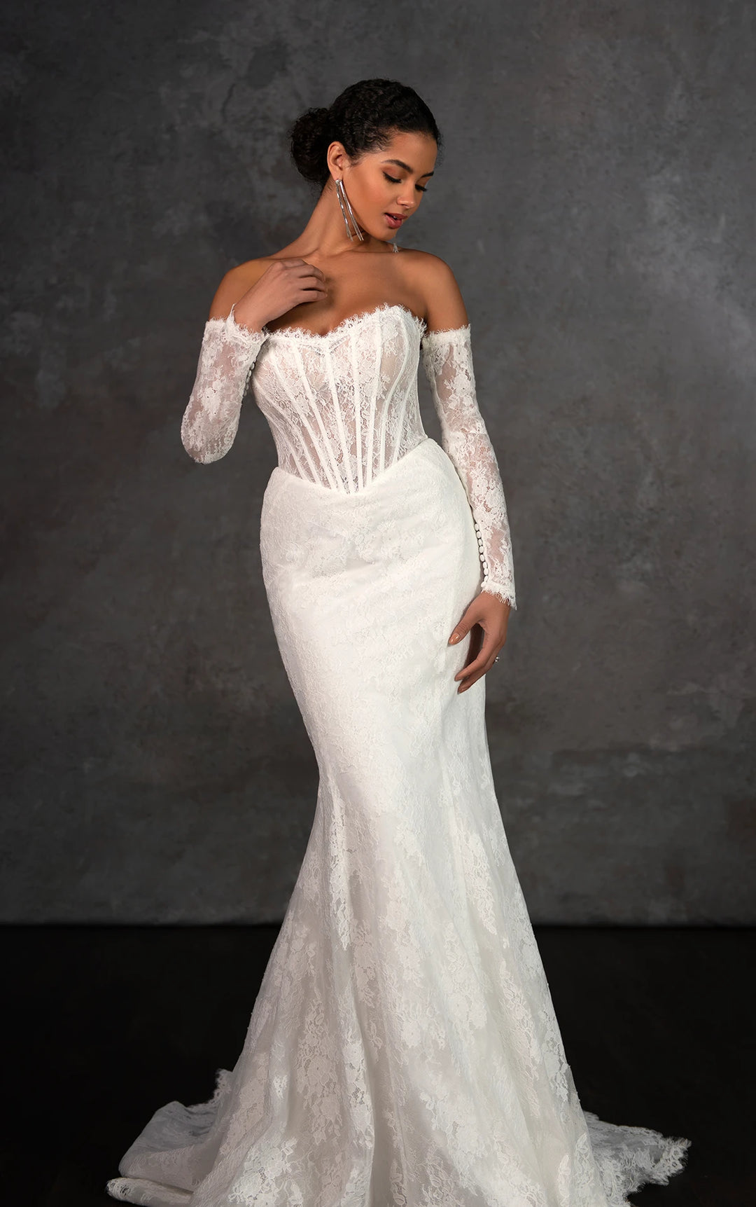 front of essense of australia d4287 ivory lace fitted wedding dress, showing the full front with strapless basque bodice and detached long sleeves