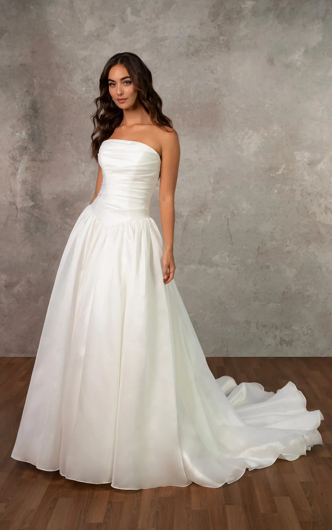 full front of essense d4454 ivory organza a-line wedding dress with a basque waist and ruched bodice