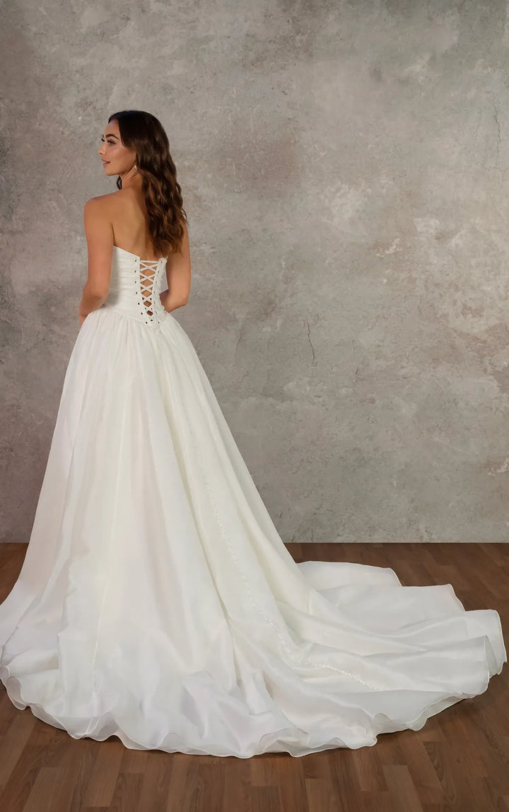 full back of essense d4454 ivory organza a-line wedding dress with a basque waist and ruched bodice