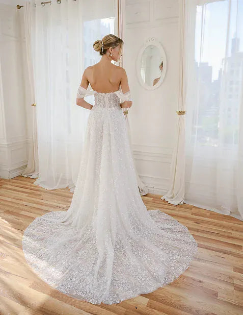 back of estee couture liv ivory sparkle tulle a-line wedding dress with a sheer short train
