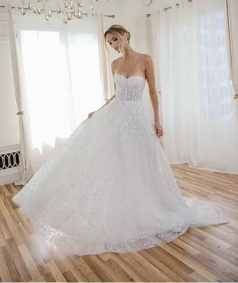 front of estee couture liv ivory sparkle tulle a-line wedding dress with a strapless sweetheart neckline, shown without the matching straps