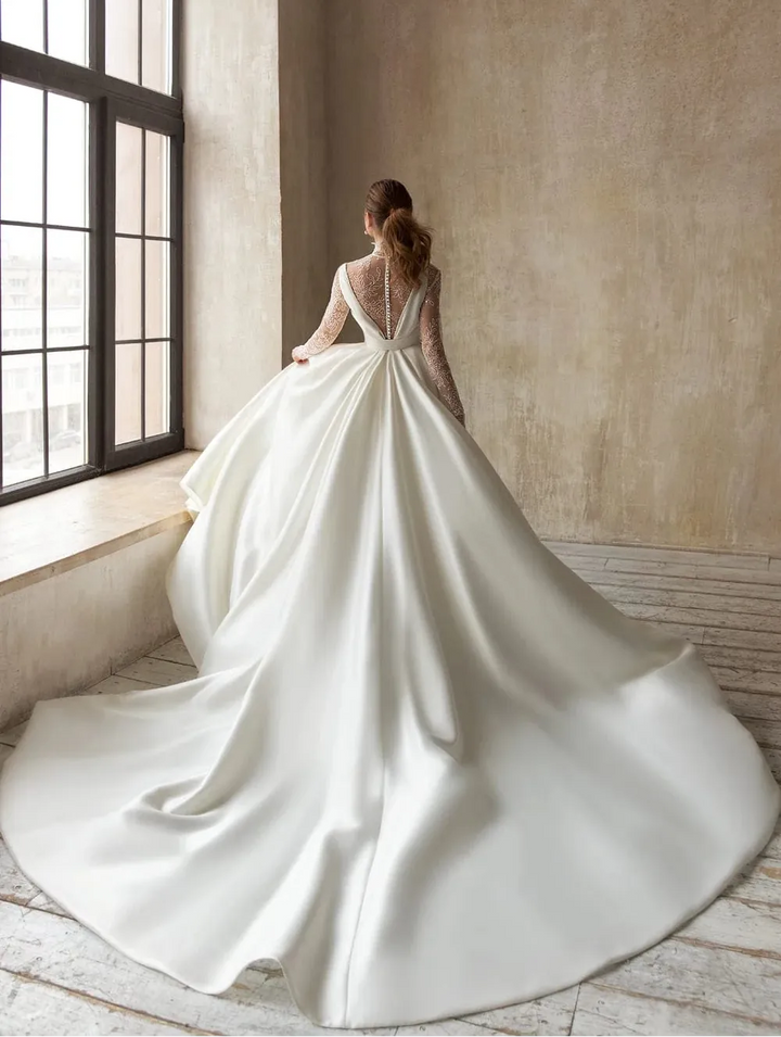 full back of eva lendel magdalena ivory mikado a-line wedding dress with a matching lace bodysuit and long train