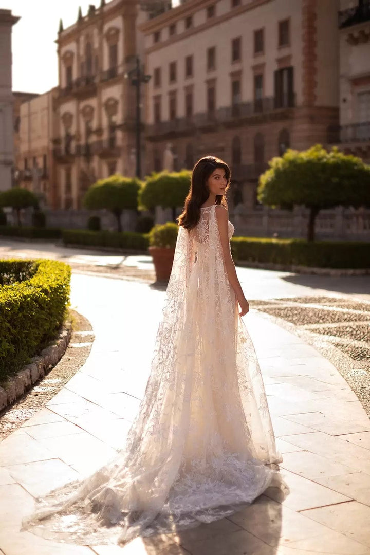 full back of eva lendel valentina ivory lace fitted wedding dress, showing the matching cape that is sold separately
