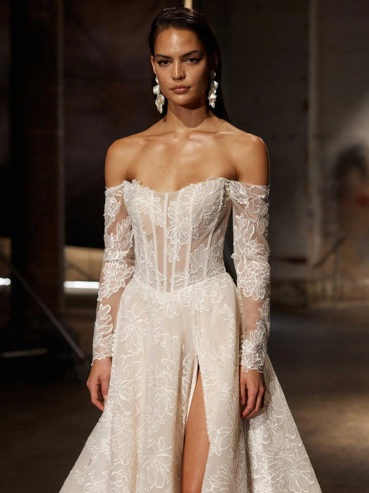 close up of evie young chevelle mocha lace a-line wedding dress showing the off the shoulder long sleeve neckline 