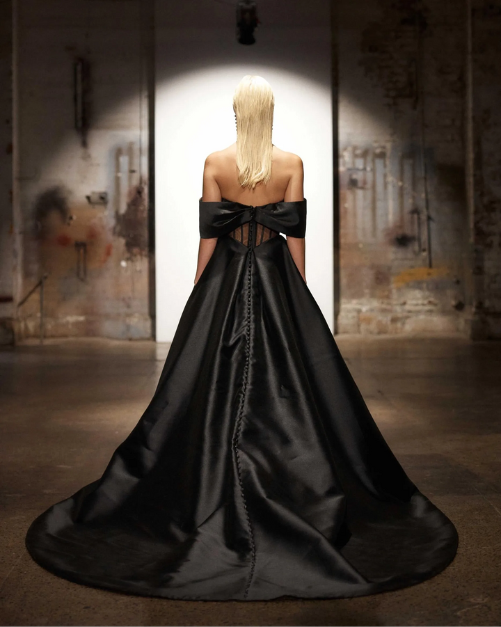 full back of evie young effie black shantung a-line wedding dress with an off the shoulder neckline and chapel length train