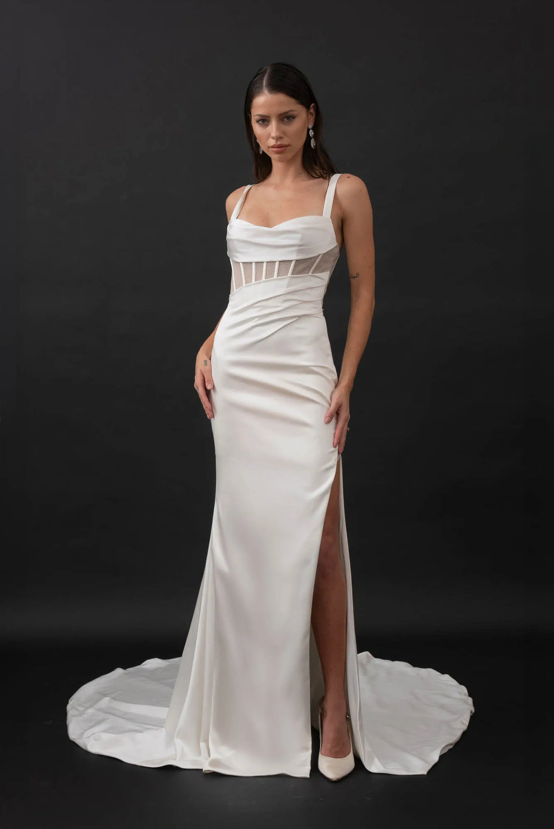 front of evie young gia ivory satin sheath wedding dress showing the sheer bodice with a sweetheart neckline, and slim skirt with a slit