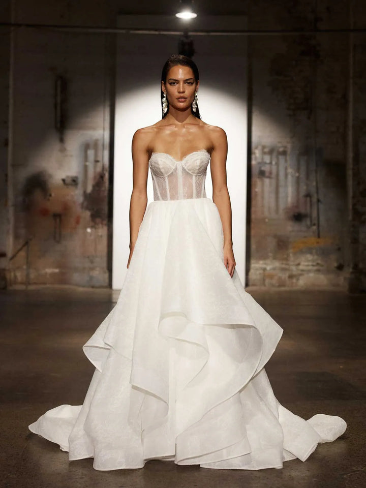 full front of evie young hollis ivory organza ball gown wedding dress shown without the matching long sleeve lace jacket