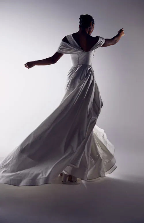 full back of georgia young gin and tonic ivory taffeta a-line wedding dress with an off the shoulder neckline and full skirt with a short train