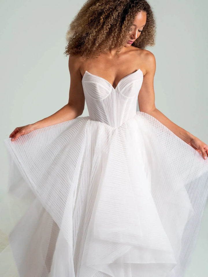 close up of hayley paige once i was a swan ivory tulle ball gown wedding dress showing the cat eye bodice