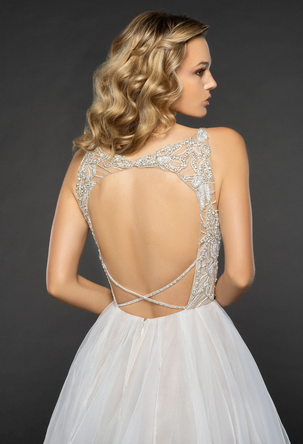 close up of the back of hayley paige warren champagne tulle a-line wedding dress with a beaded bodice