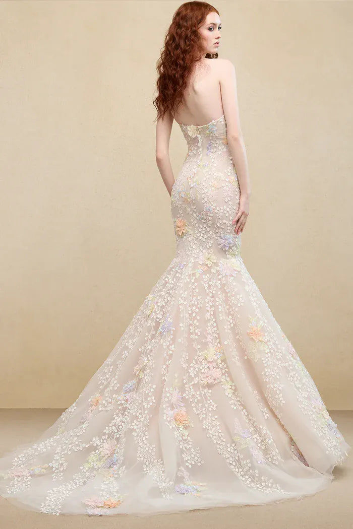 back of ines di santo tango champagne tulle fit and flare wedding dress with multi colored floral lace accents throughout, and a chapel length train