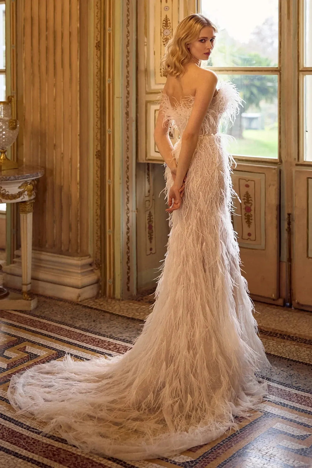 full back of ines di santo wing nude fitted wedding dress showing the allover feathers