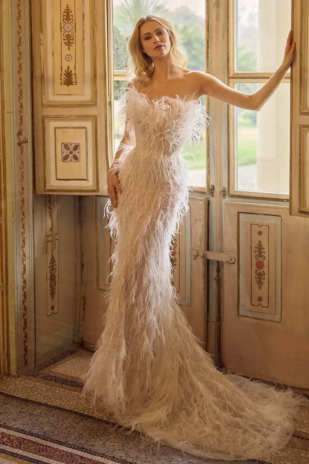 full front of ines di santo wing nude fitted wedding dress showing the allover feathers
