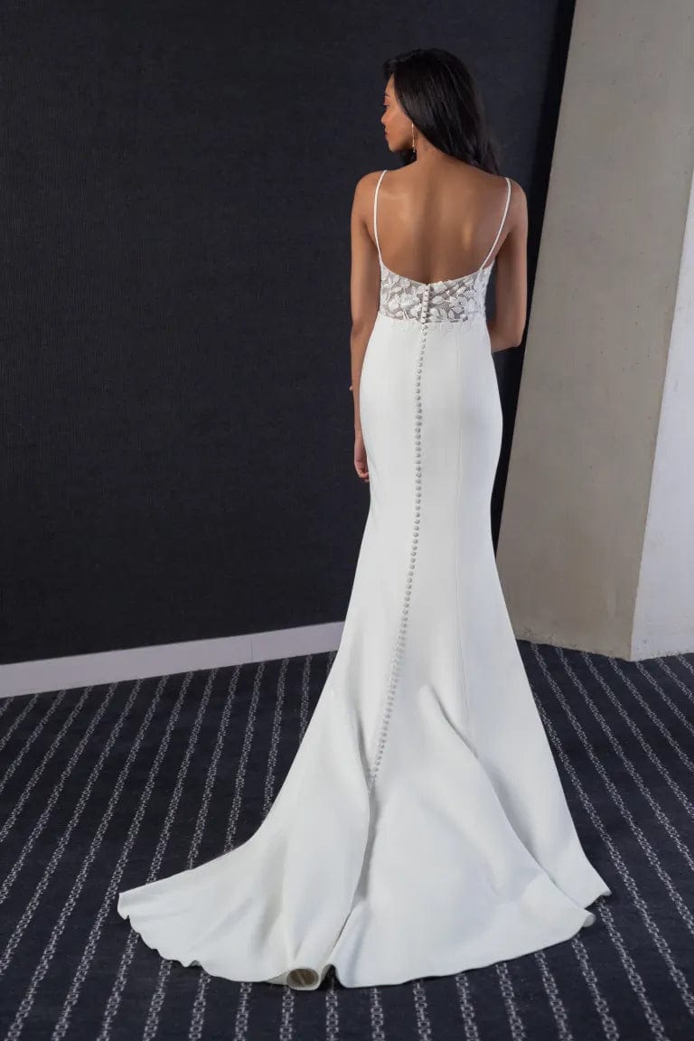 full back of jenny yoo christina ivory crepe fitted wedding dress with a lace applique bodice and short train