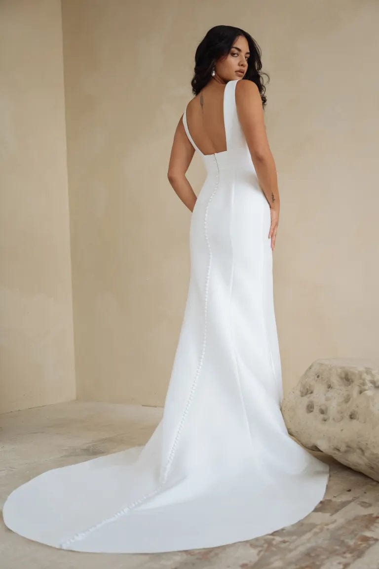 full back of jenny yoo ilana ivory crepe fit and flare wedding dress with a square back and short train