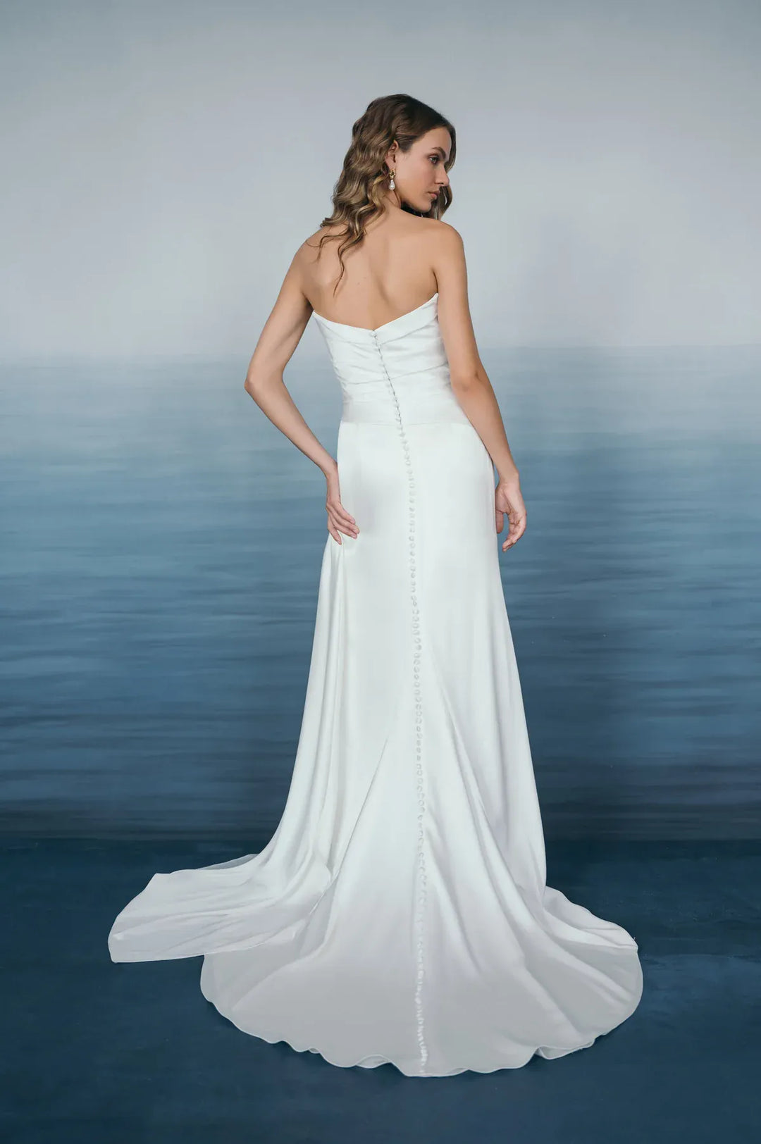 full back of jenny yoo lana satin sheath wedding dress with a strapless bodice and short train