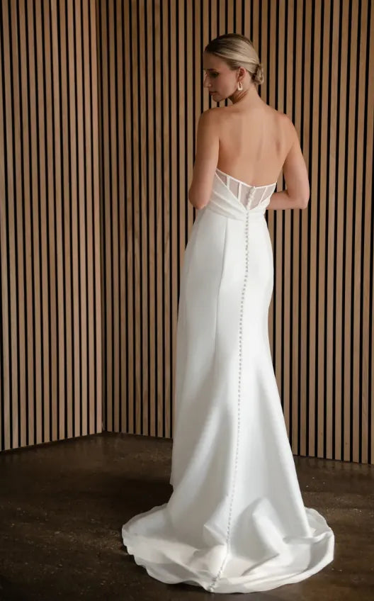 back of jenny yoo lola ivory crepe fitted wedding dress with a sheer illusion back with covered buttons down the skirt