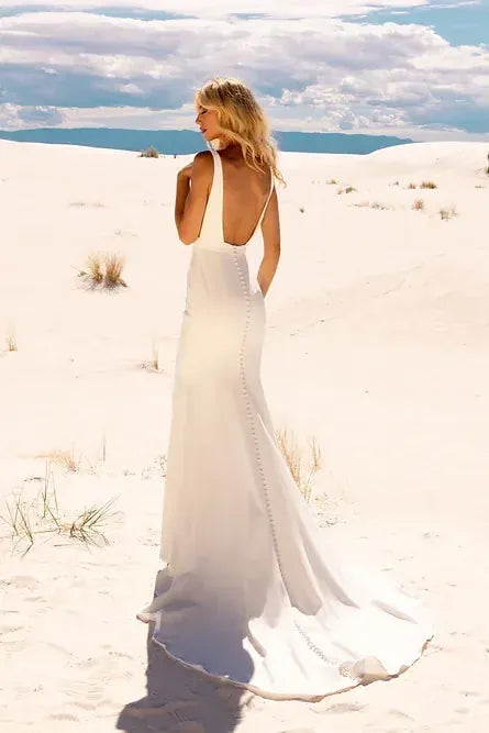 full back of jimme huang ivory crepe fitted wedding dress with a square neckline and waist belt