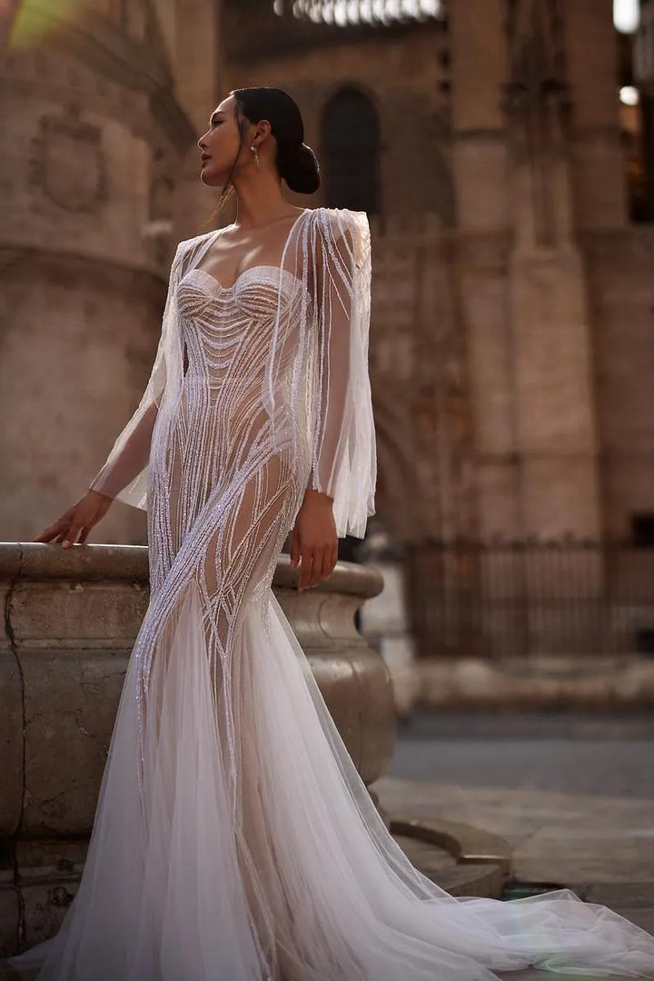 full front of julie vino dominique nude beaded tulle fitted wedding dress featuring a sweetheart neckline and matching cape