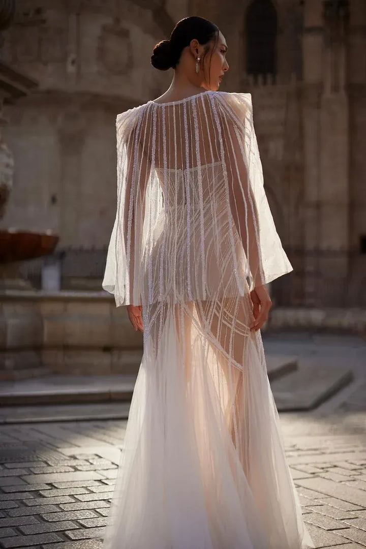 full back of julie vino dominique nude beaded tulle fitted wedding dress featuring a matching cape