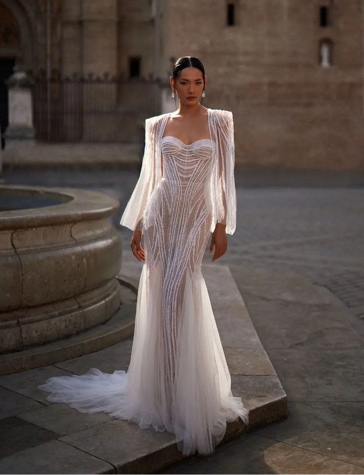 full front of julie vino dominique nude beaded tulle fitted wedding dress featuring a sweetheart neckline and matching cape