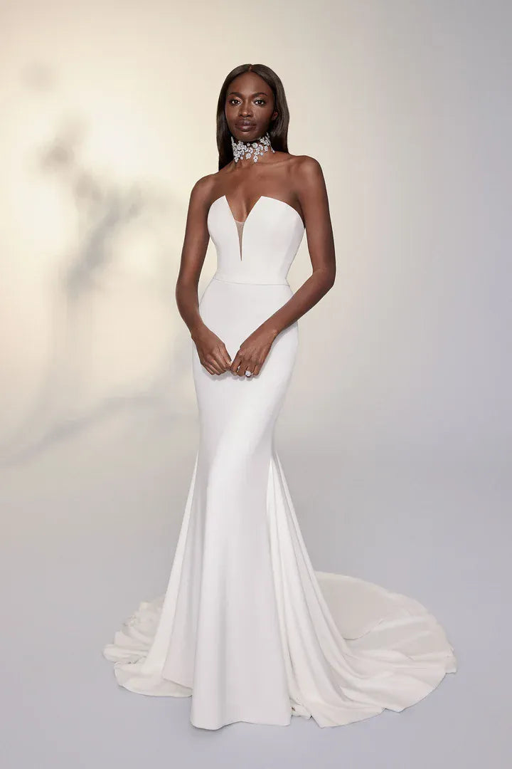 full front of justin alexander 99115d ivory crepe fit and flare wedding dress with a deep V neckline