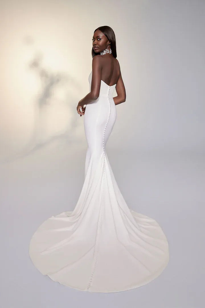 full back of justin alexander 99115d ivory crepe fit and flare wedding dress with a chapel length train