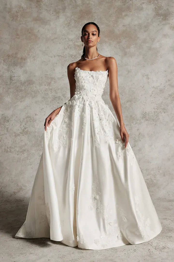 full front of justin alexander 99291 ivory satin a-line wedding dress with dimensional floral accents on the bodice that float onto the skirt