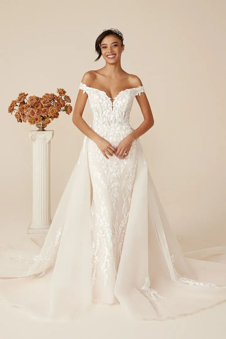 front of justin alexander deidra fitted lace wedding dress with off the shoulder neckline and matching overskirt