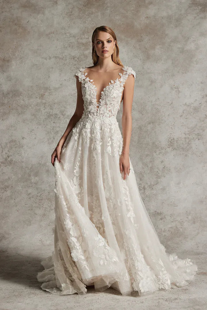 full front of justin alexander venetia nude tulle a-line wedding dress covered in floral lace accents throughout, with a plunging neckline