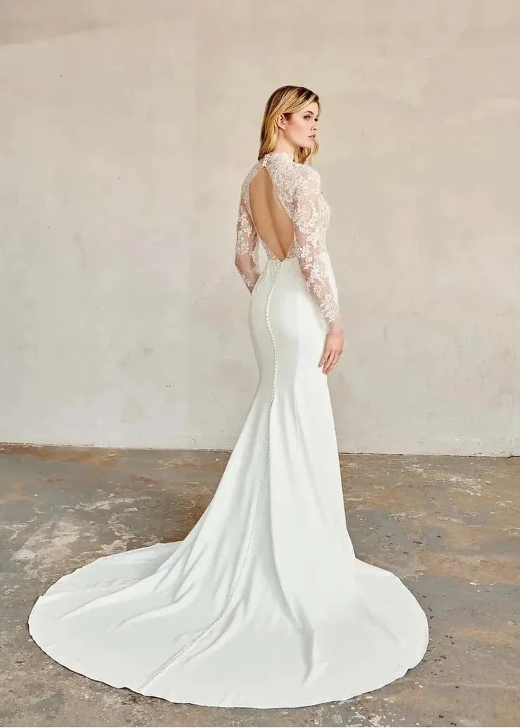 full back of kelly faetanini forest ivory crepe fitted wedding dress with a lace bodice and open keyhole back above the train