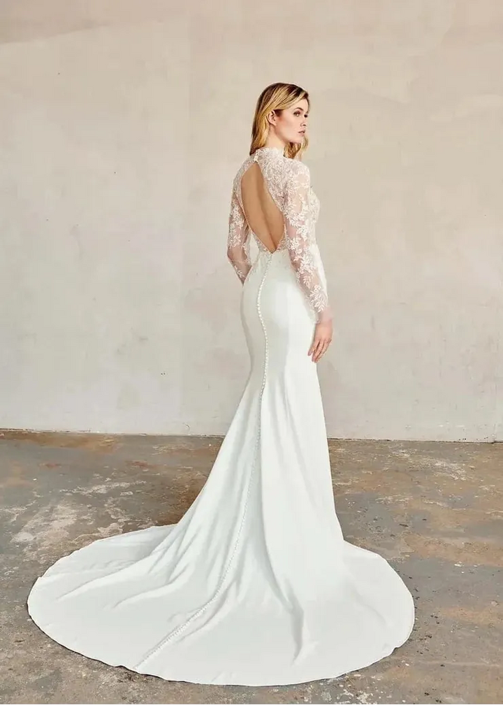 full back of kelly faetanini forest ivory crepe fitted wedding dress with a lace bodice and open keyhole back above the train