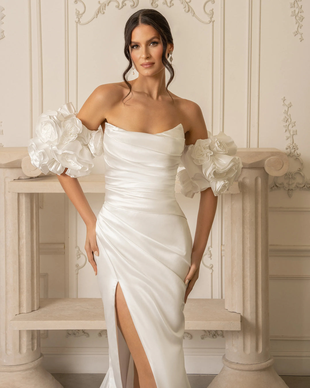close up of kitty chen maureen ivory satin fit and flare wedding dress showing the matching puff sleeves